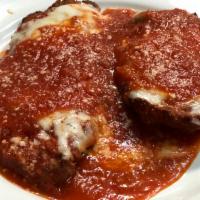 Chicken Cutlet Parmigiana · Dinner portion. Chicken cutlet topped with tomato sauce and melted mozzarella. Served with c...