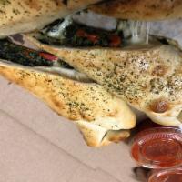 Spinach and Roasted Peppers Pizza Rolls · spinach and roasted red peppers with melted mozzarella cheese in a freshly baked roll