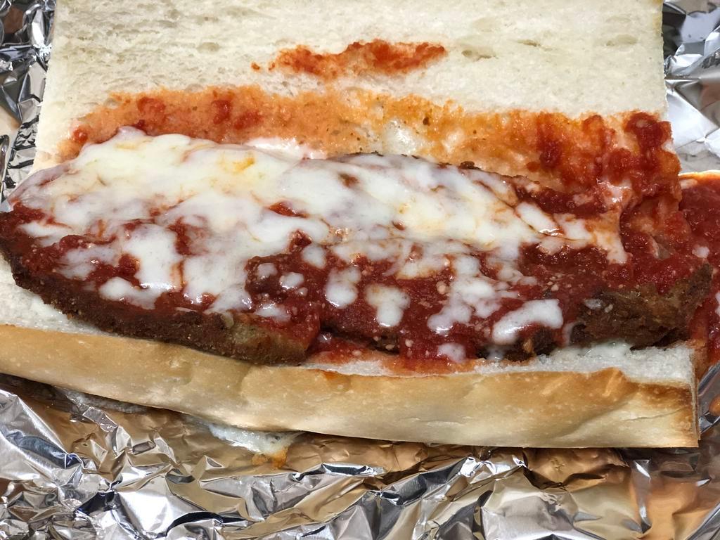 Chicken Parmesan Hero · Fried chicken cutlet baked in our homemade tomato sauce, topped with mozzarella cheese served on fresh Italian toasted bread