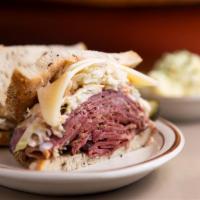 Pastrami and Swiss Sky High Sandwich · Topped with cole slaw and Russian dressing on rye bread. Served with potato salad. 