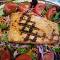 Asian Grilled Salmon Salad  · Grilled salmon filet on a bed of field greens with scallions, snap peas, carrots, red onion,...