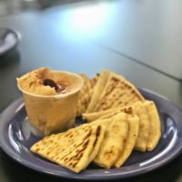 Hummus and Pita · Homemade hummus served with slices of Mediterranean pita.

Note: Prices are 30% higher here ...