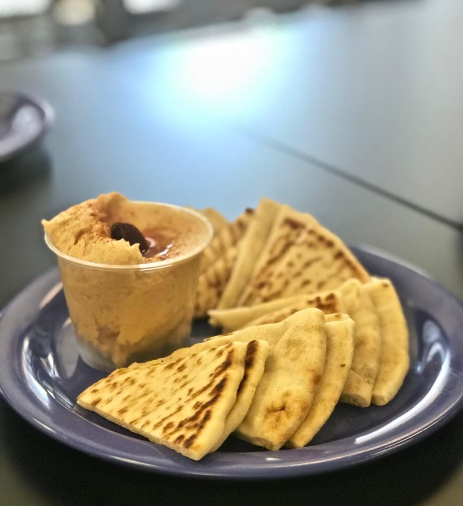 Hummus and Pita · Homemade hummus served with slices of Mediterranean pita.

Note: Prices are 30% higher here than in store. Call us for pick up!
