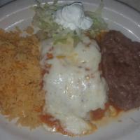 Chicken Enchiladas · 2 corn tortillas filled with shredded chicken topped with ranchero sauce and melted cheese. ...