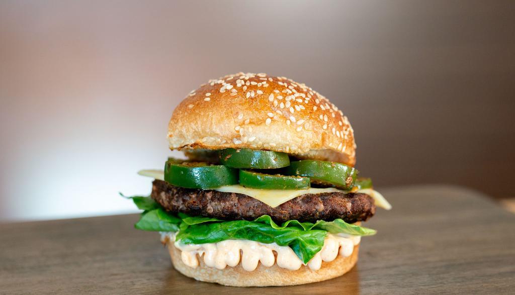 Spanish Beef · 1/3 lb. Spanish Beef patty, styled with our Caliente toppings, including our signature habanero aioli, grilled jalapeños, leaf lettuce, pepper jack cheese.