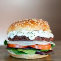 Greek Lamb · 1/3 lb. Lamb Patty, styled with our Greek toppings featuring our signature Tzatziki sauce, m...