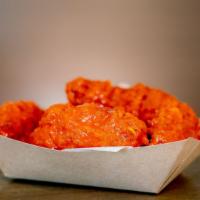 Chicken Wings · Our breaded bone-in wings tossed with your choice of house-made sauces including, Buffalo, B...
