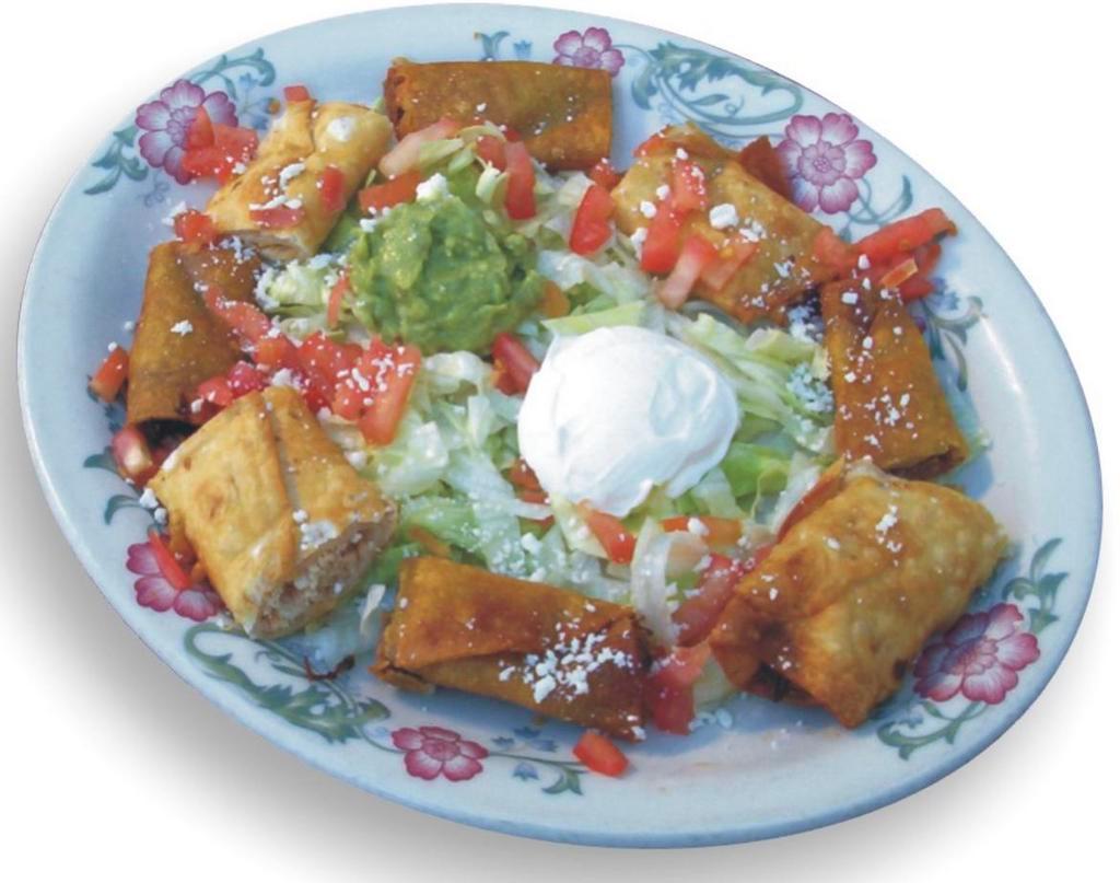 Taquitos Rancheres and Chicken Taquitos · Served with lettuce, tomatoes, green onions, cheese, sour cream and guacamole.