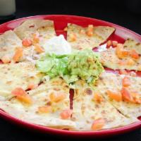 Quesadilla Grill · Soft flour tortilla stuffed with grilled chicken breast, melted cheese, fresh bell peppers a...
