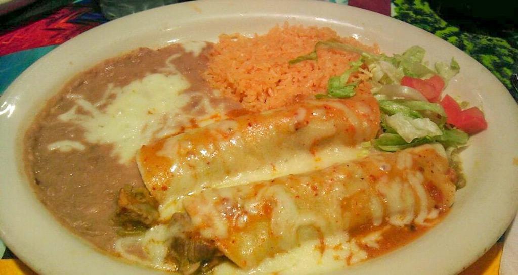 Enchiladas Cremadas · 2 corn tortillas filled with shredded chicken. Topped with delicious cream sauce and Monterrey Jack cheese.