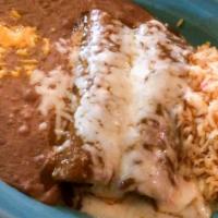 Mole Enchiladas · 2 corn tortillas stuffed with tender shredded chicken. Topped with delicious sweet spicy mol...