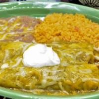Enchiladas Verdes · 2 corn tortillas filled with chunks of pork. Topped with tomatillo green sauce and melted ch...