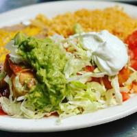 Burrito Deluxe · A flour tortilla filled with your choice of chicken, beef, shredded beef or pork. Smothered ...