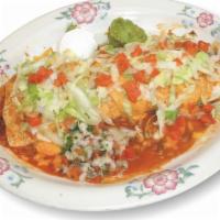 Burrito Fajita · A super burrito. Tender of sirloin or chicken marinated and grilled with fresh green peppers...