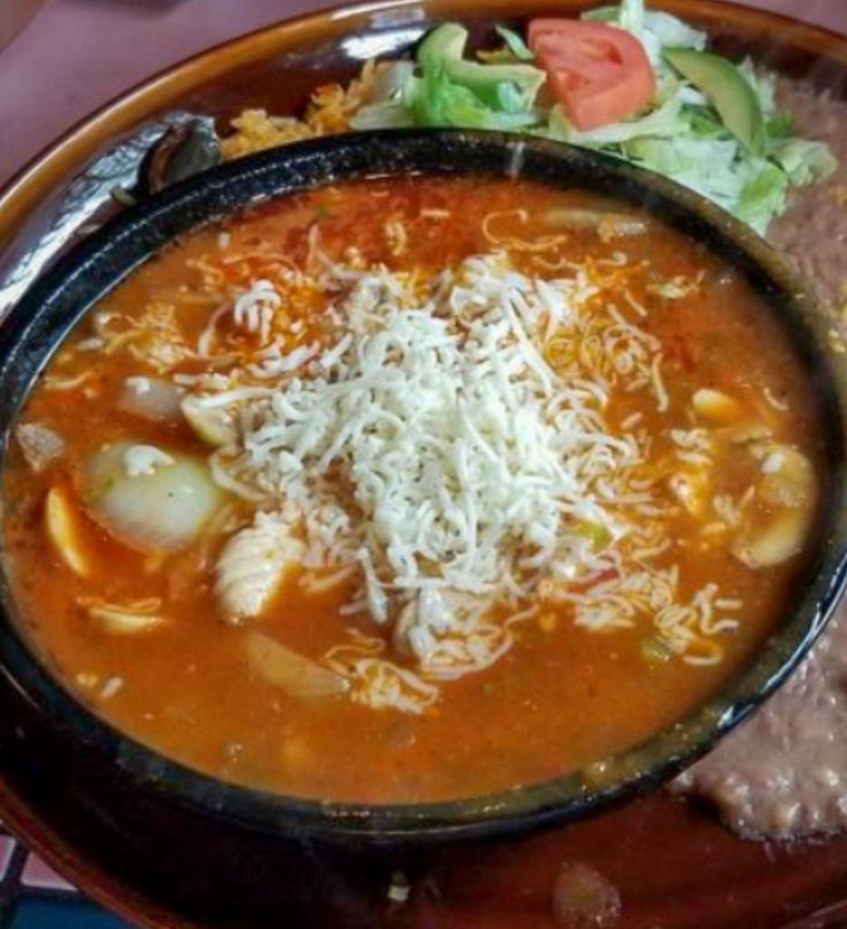 Molcajete · Delicious bowl of chicken and beef, sauce with mushrooms, onions and Monterey Jack cheese. Served with  tortillas.