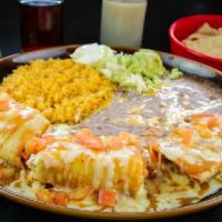 Pollo Pundido · Deep fried flour tortilla, filled with Jack cheese. Topped with tasty garnished with sour cr...