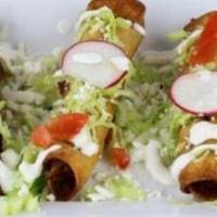 Flautas · Crisp corn tortilla stuffed with shredded beef or chicken, garnished with lettuce, tomatoes,...