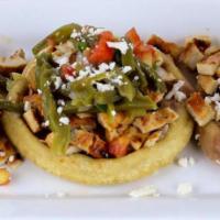 Sopes Revolucionarios · Homemade thick and crispy corn tortilla with pinched side with your choice of carne asida, a...
