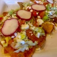 Enchiladas Mexicanas · 4 corn tortillas stuffed with your choice of chicken, ground beef or shredded beef. Topped w...
