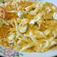 Pollo a la Crema · Boneless chicken in delicious Parmesan cheese cream sauce with mushrooms, carrots, celery an...