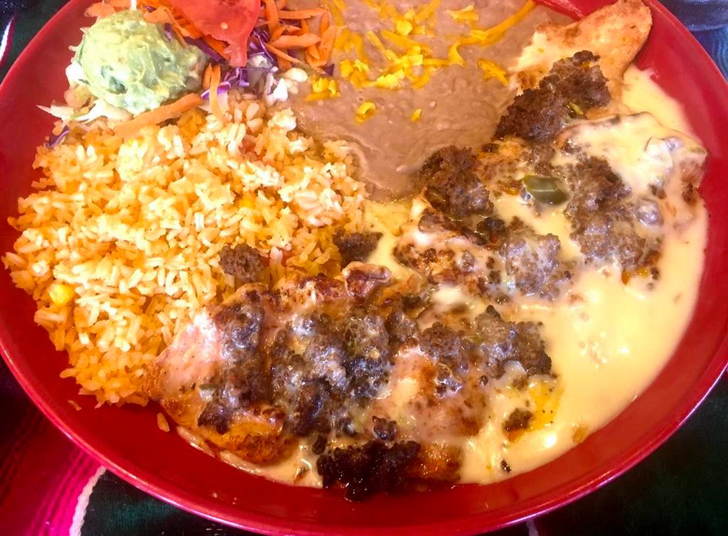 Chori-Pollo · Broiled chicken breast marinated with special sauce, topped with cheese dip sauce and sprinkled with Mexican chorizo.