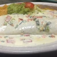 Seafood Burrito · Large flour tortilla stuffed with scallops, shrimp and crab meat. Topped with a special sauc...