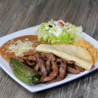 41. Carne Asada Plate · Grilled steak. Served with rice, beans and salad.