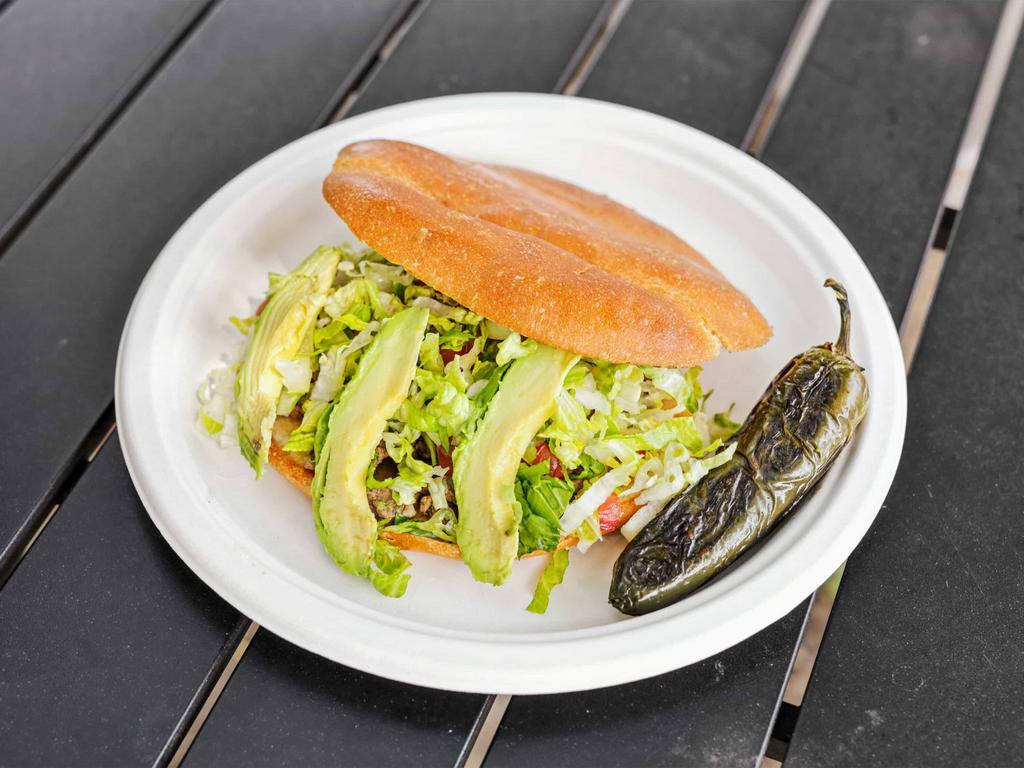 Torta · Fresh bread filled with your choice of meat, sliced avocado and salsa verde.
