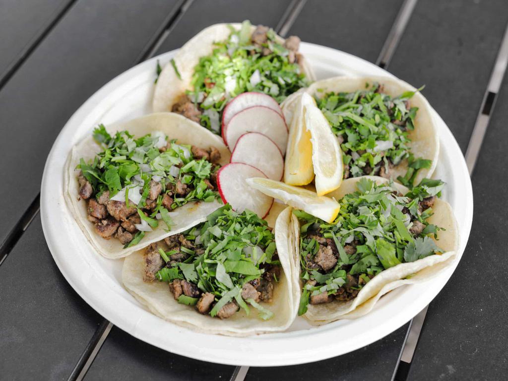 5  beef Tacos · Corn tortillas, your choice of meat topped with onions and cilantro. Carnitas, beef, chicken, pork belly, and chorizo.

