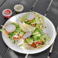 Fish Tacos · 3 pieces. Grilled tilapia served with pico de gallo, lettuce, cilantro and a house dressing....