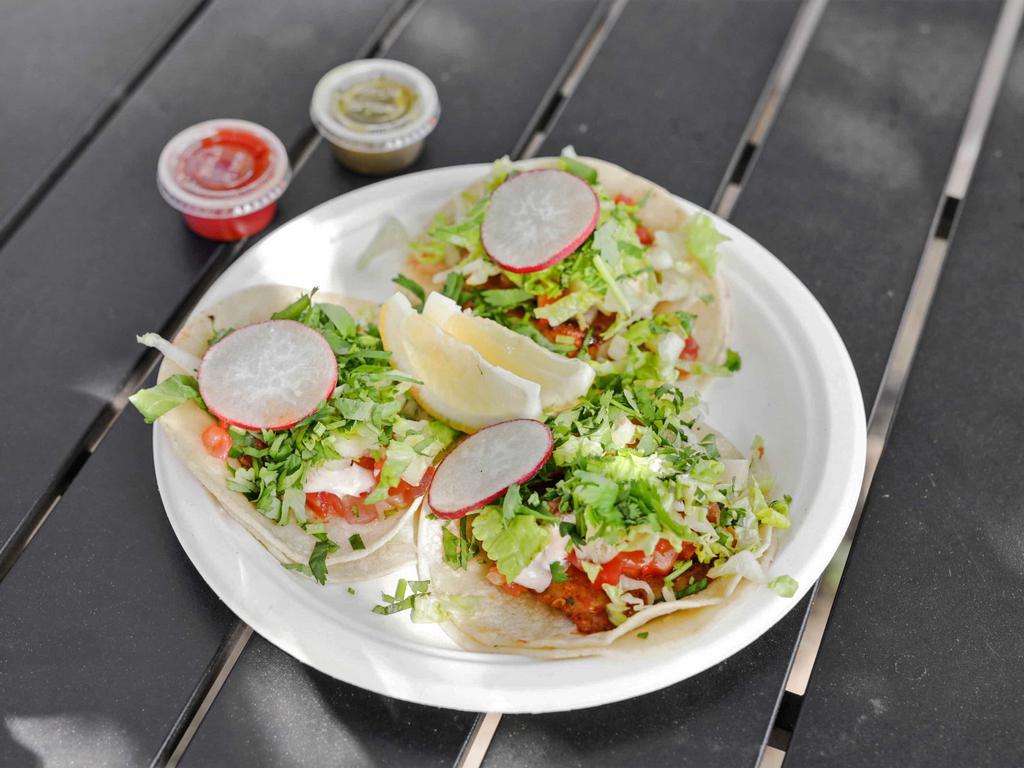 Fish Tacos · 3 pieces. Grilled tilapia served with pico de gallo, lettuce, cilantro and a house dressing. If you want more tacos compared to when you order 3 tacos your going to be charged $3.50 more for each taco. Price depends on how many more you order
