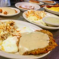 #1. Texas Size Breakfast · 2 eggs with hash browns or grits, biscuits or toast, gravy and choice of style.