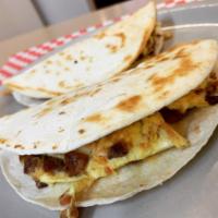 2 Breakfast Tacos · 2 eggs with cheese, bacon or sausage.