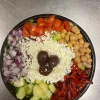 Chopped Mediterranean Salad · Chopped romaine topped with chopped tomatoes, grilled red peppers, cucumbers, chick peas, re...