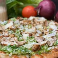 Grilled Chicken Caesar Pizza · Brushed olive oil, grilled chicken, shaved romaine, Caesar dressing mozzarella, shaved Parm ...
