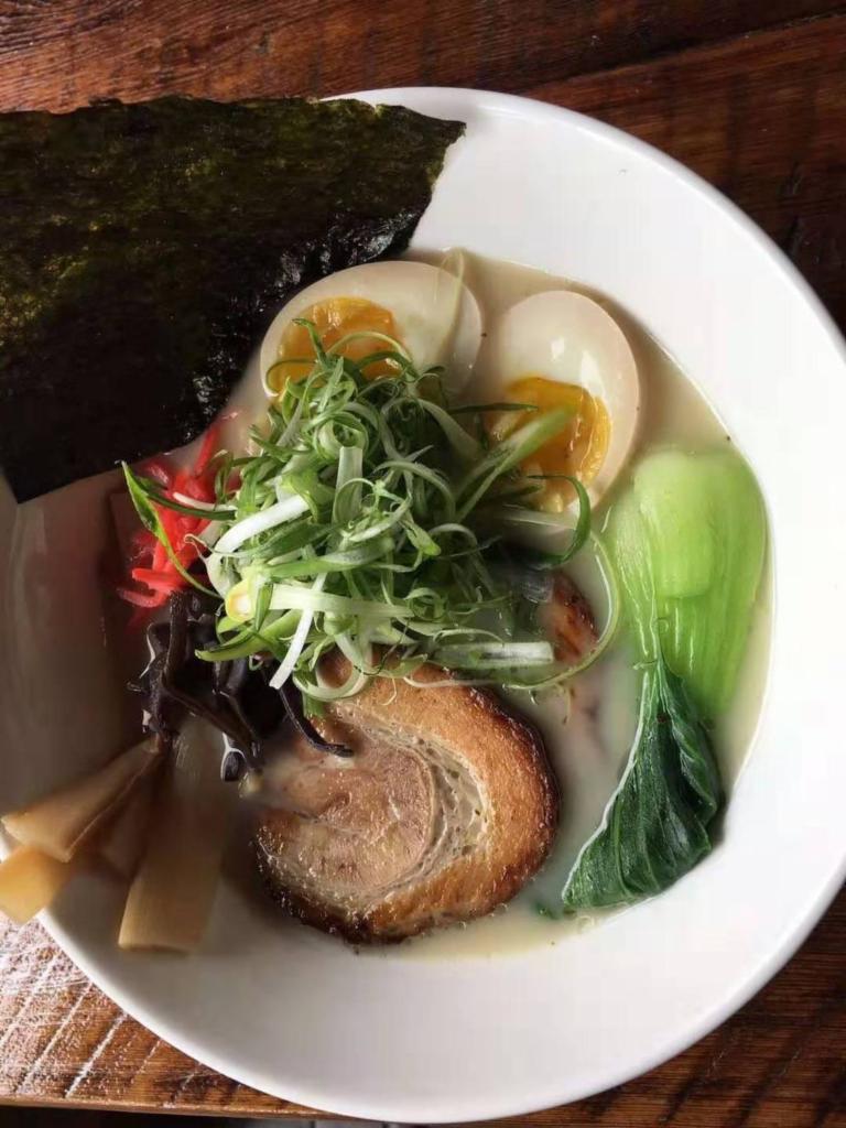 1. Tonkotsu Ramen · Tonkotsu based broth topped with pork belly scallions, bamboo shoots, red ginger, black fungus, boil egg and Asian vegetables.