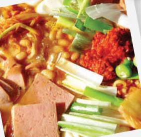 Budae Stew · Spicy stew with ramen, spam, sausage, rice cake, fishcake, & tofu.