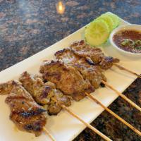 Thai BBQ Pork Skewer  · Grilled marinated pork on skewers, toasted rice-mint-lime sauce.