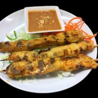 Chicken Satay · 3 kabob style skewers loaded with chicken, seasoned with lemon grass, curry powder and lime ...