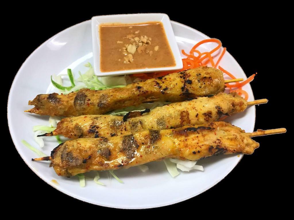 Chicken Satay · 3 kabob style skewers loaded with chicken, seasoned with lemon grass, curry powder and lime leaf marinade.