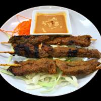 Beef Satay · 3 kabob style skewers loaded with beef, seasoned with lemon grass, curry powder and lime lea...