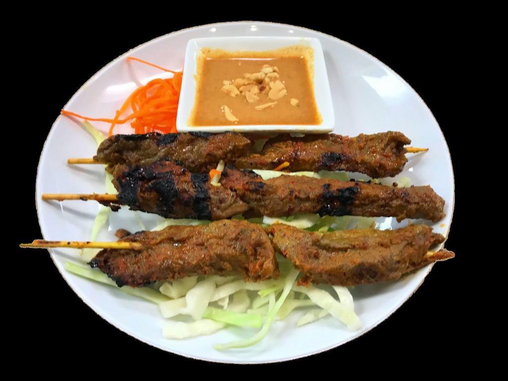 Beef Satay · 3 kabob style skewers loaded with beef, seasoned with lemon grass, curry powder and lime leaf marinade.