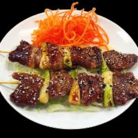 Beef Kushiyaki · Diced beef tenderloin skewered with scallions, grilled and served with a side of teriyaki sa...