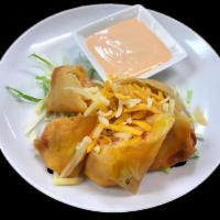 Crispy Bacon · Bacon and cheese wrapped in spring roll skin, deep fried, served with a special creamy white...