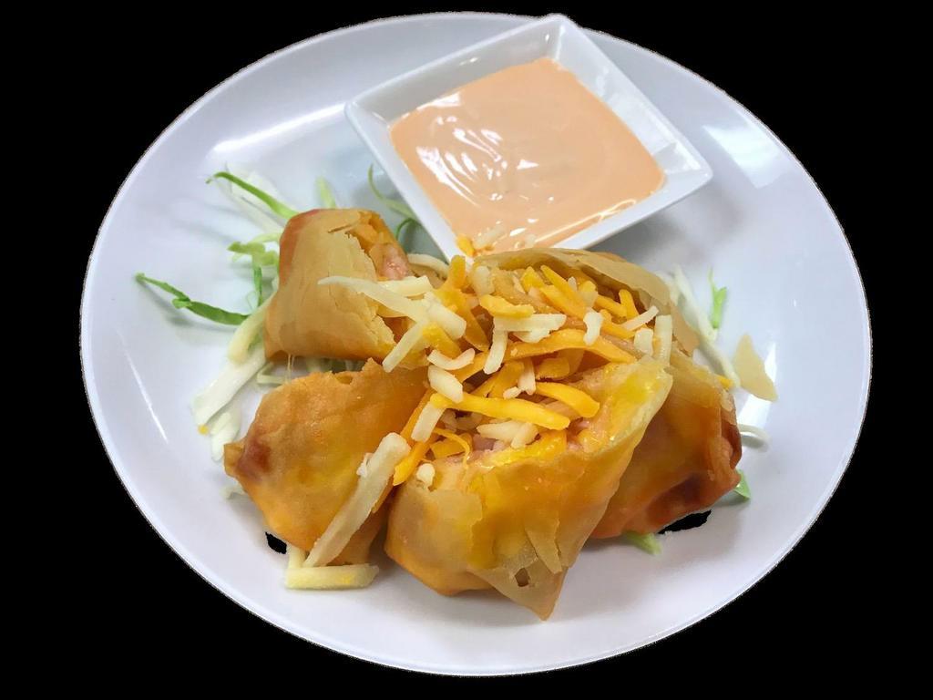 Crispy Bacon · Bacon and cheese wrapped in spring roll skin, deep fried, served with a special creamy white sauce.