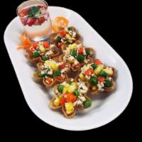 Crispy Cups · A classic Thai snack in crispy golden cups filled with a combination of minced chicken, swee...