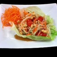 Papaya Salad · Shredded green papaya, carrots, tomatoes and peanuts tossed in Thai special lime juice with ...