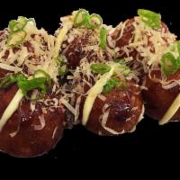 Takoyaki · Deep fried octopus ball with mayo and brown sauce topped with bonito flakes and scallions.