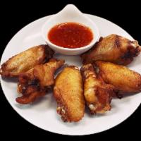 Thai Chicken Wings · Thai style chicken wings served with a sweet chili sauce.