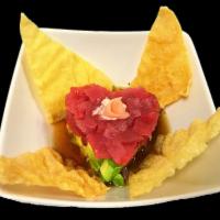 Tuna in Love · Diced tuna and avocado served with crispy wontons topped with a sesame soy ginger sauce, spi...